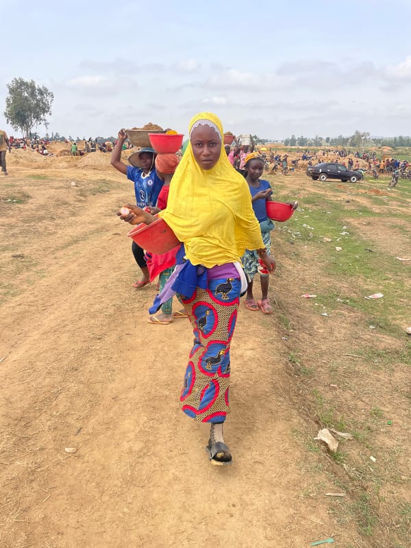 Group gathers in dry grassland in Durumi, Nigeria