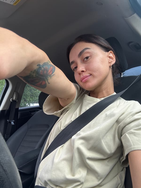 Inside a parked car in Tbilisi, quick selfie-style shots