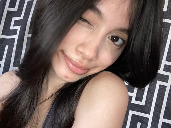 Woman photographed winking and smiling in Panabo, Philippines