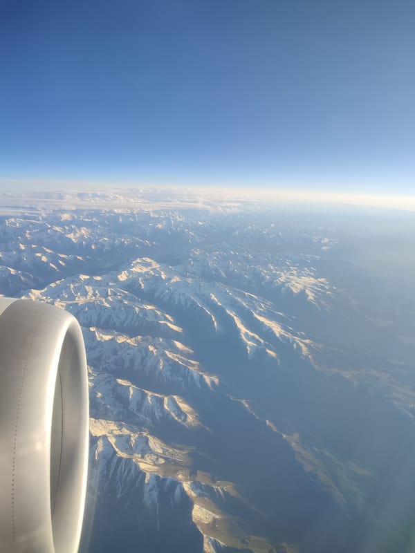 Aerial view captures snow-capped mountains from airplane over China
