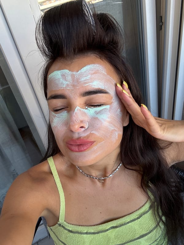 Green face mask, hair rollers, balcony views — skincare morning in.
