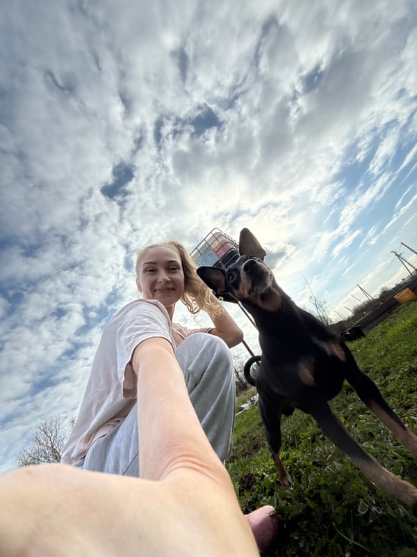Woman takes selfie, cat spotted amid construction in Russian village