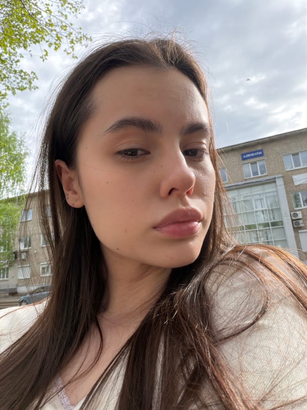 Woman photographs herself in Chaikovsky park amid urban debris