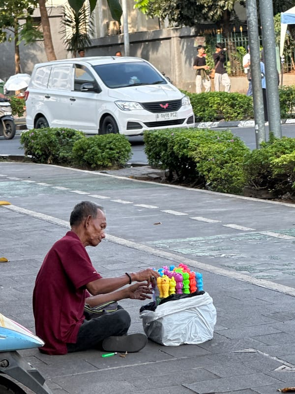 Ordinary street life documented across West Jakarta neighborhood