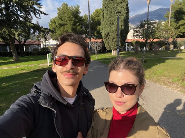 Woman documents afternoon sightseeing tour through coastal Budva, Montenegro