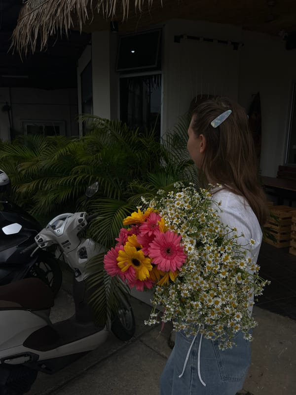 Woman photographed with colorful flower bouquet in Phuket Thailand