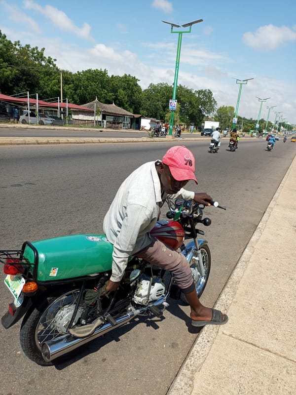 Motorcycle traffic and street life in Tempure, Nigeria