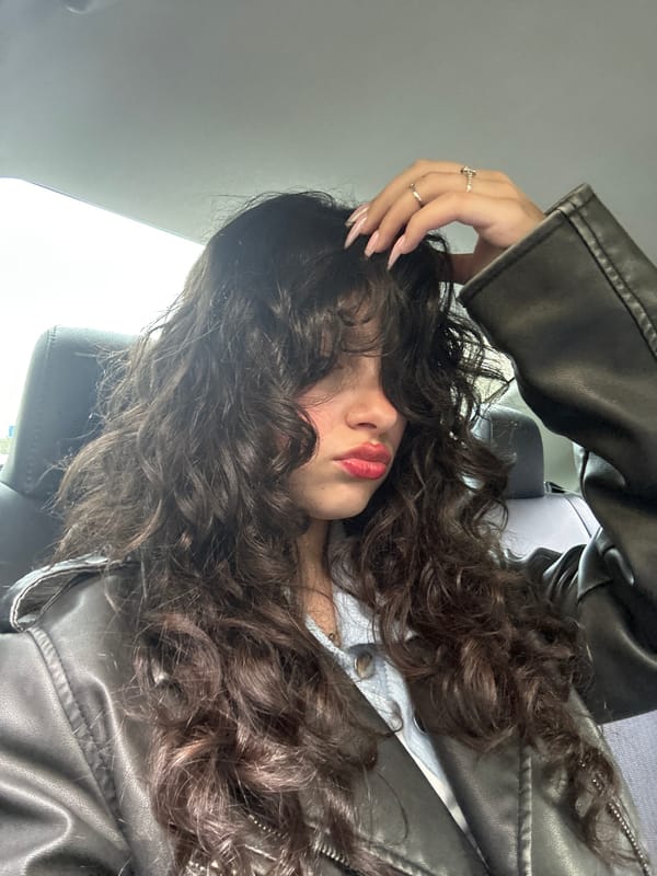 Woman photographed in car backseat selfie session in Yerevan