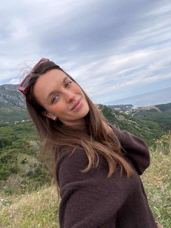 Tourist captures selfie at Montenegro's scenic Sveti Stefan overlook