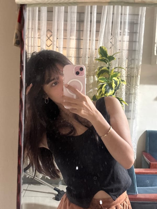 Woman takes mirror selfies at home in Tagum, Philippines