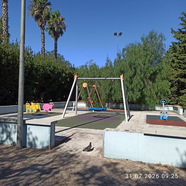 Sunny morning at a Modugno playground and street