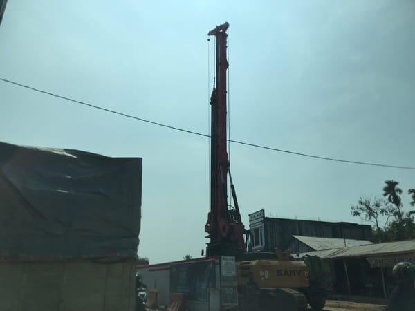 Morning scenes captured across Indonesian towns show construction, vendors
