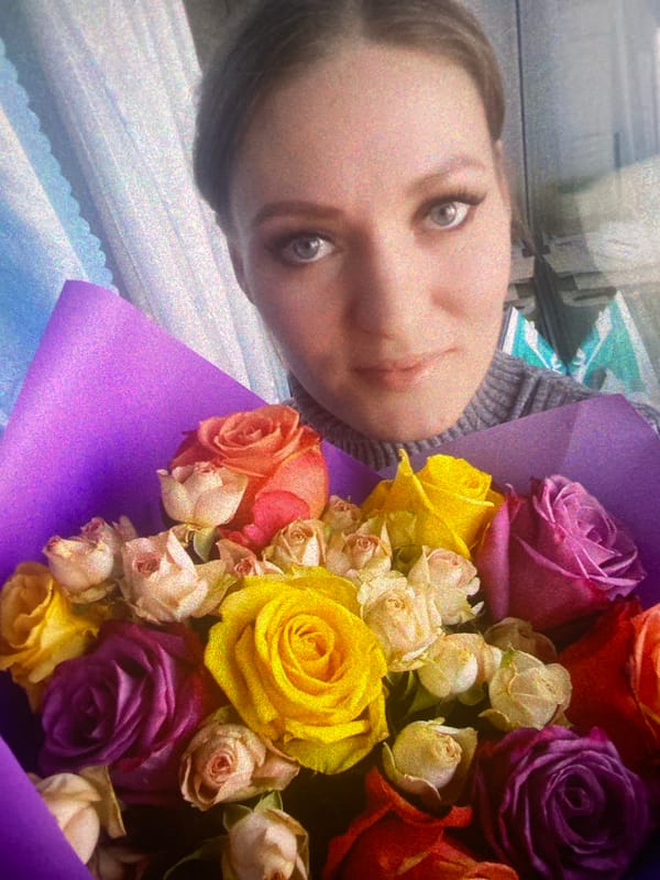 Woman with roses, cat spotted in Saint Petersburg evening