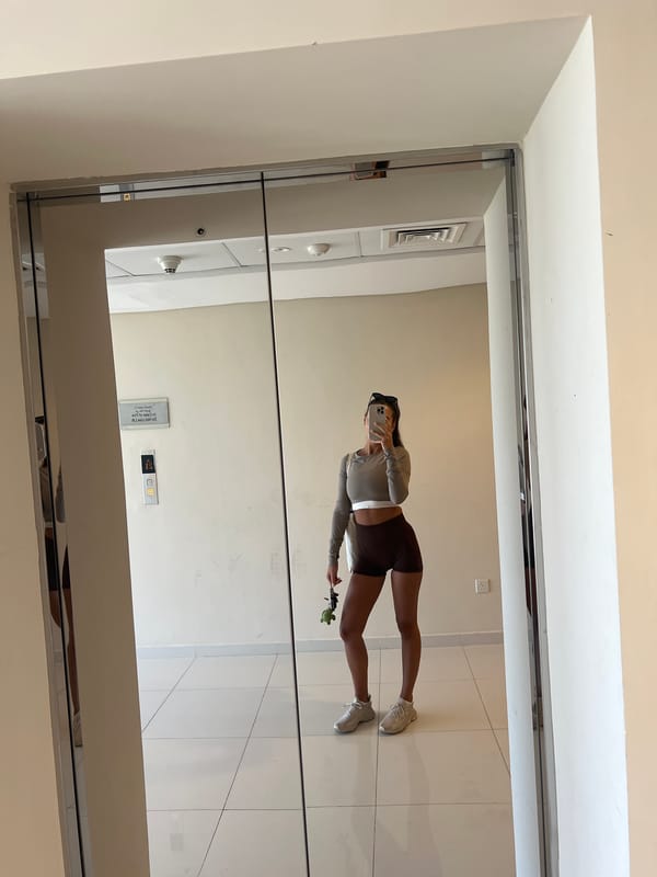 Woman takes mirror selfie in Dubai public space