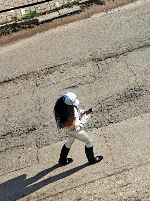 Person in silver suit spotted on cracked pavement in Bulgaria