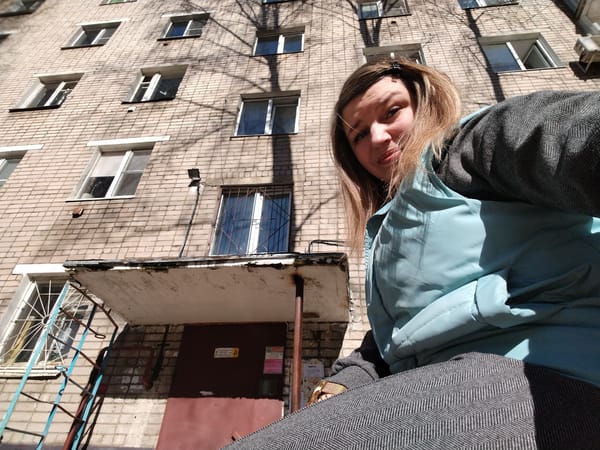 Woman takes selfies near apartment building in Yaroslavl