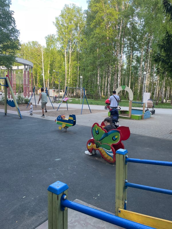 Family playground visit documented in Perm, Russia park
