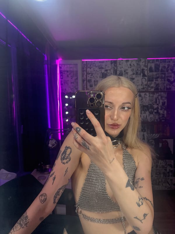 Woman takes selfies in neon-lit Moscow venue
