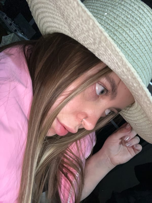 Woman in straw hat photographed in Novopokrovskaya, Russia