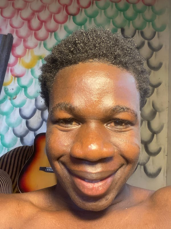 Portrait of smiling young man photographed in Mararaba, Nigeria
