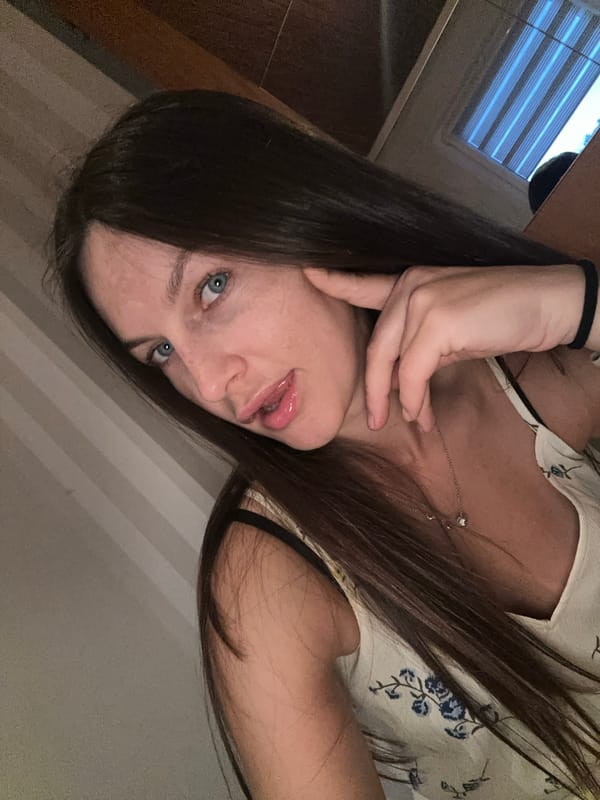 Young woman takes selfies during evening photo session in Germany