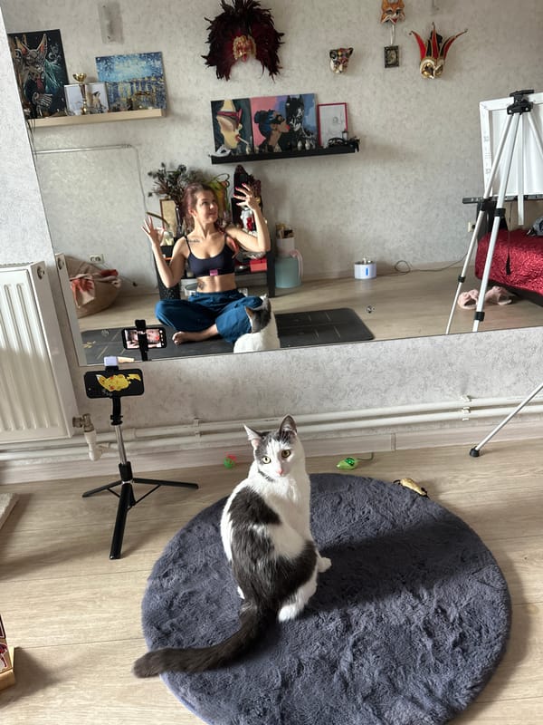 Woman films yoga session with cat in Vladimir mirror