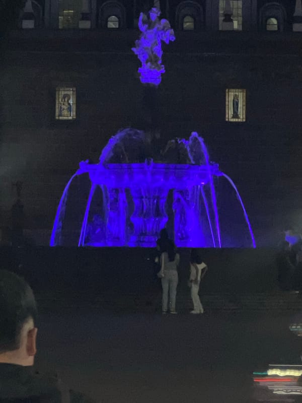 Electric blue art installation illuminated at night