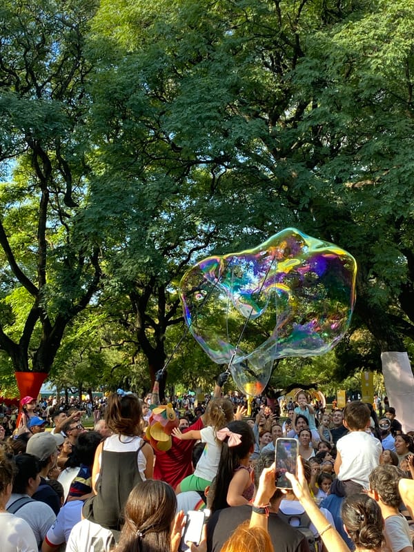 Costumed performers and families gather in Buenos Aires parks