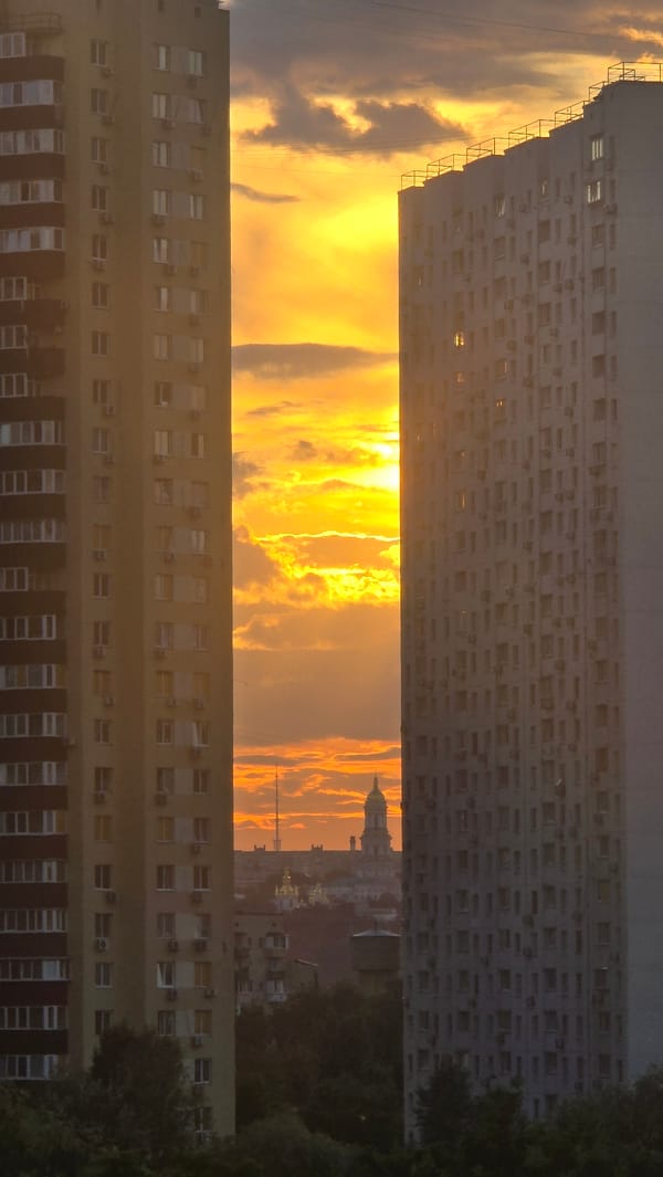 Kyiv residential skyline glows at sunset