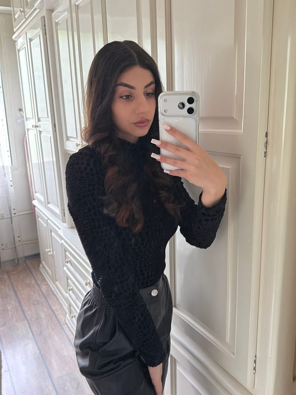Woman takes selfies indoors in Gabrovo, Bulgaria