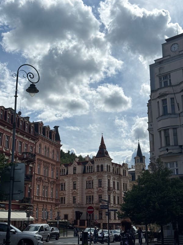 Tourist captures historic architecture during afternoon walk in Karlovy Vary