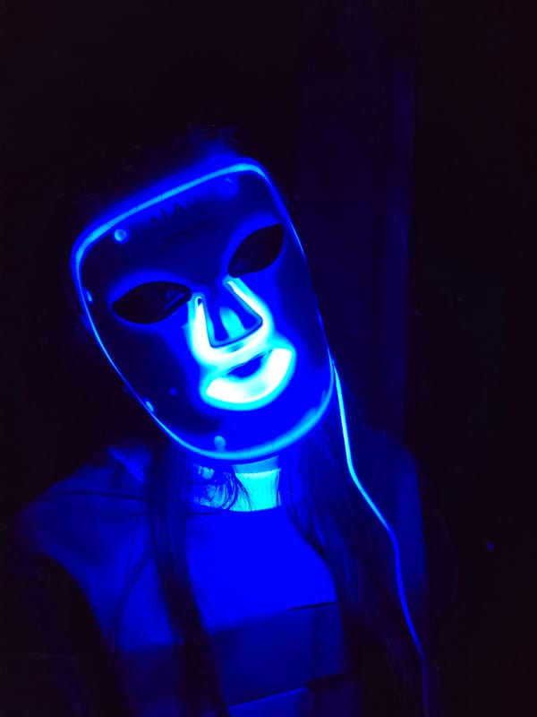 Person uses LED light therapy masks in evening session