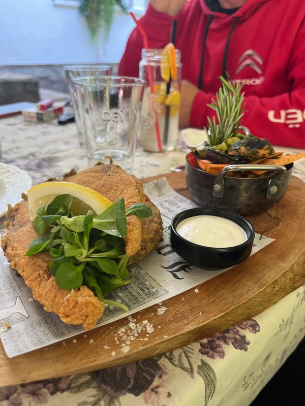 Meal on wooden platter documented at unknown location