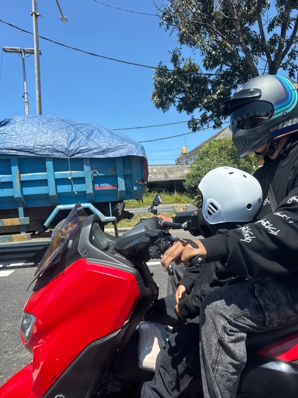 Early morning motorcycle traffic observed in Denpasar streets