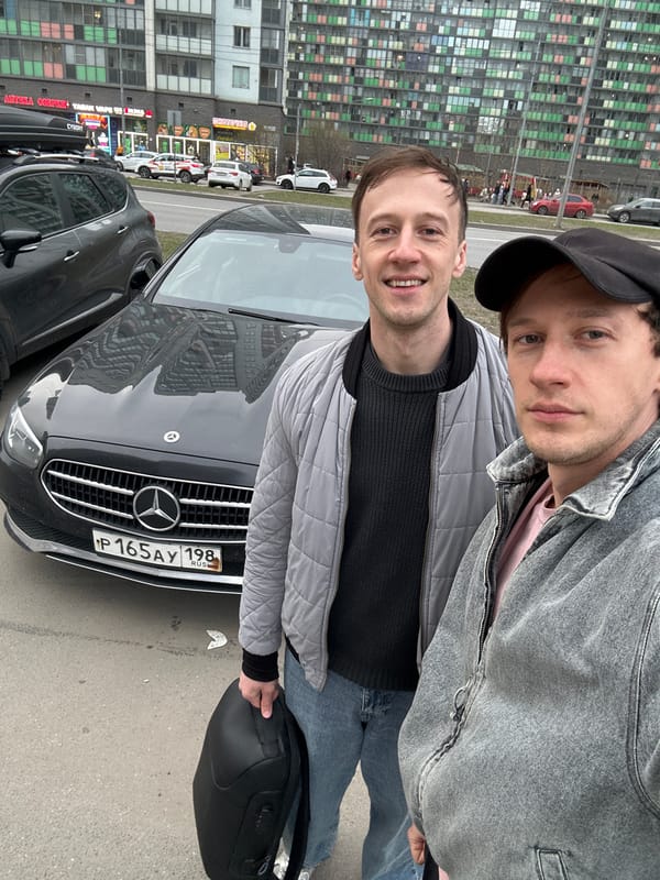 Two men photographed with Mercedes-Benz in Murino, Russia