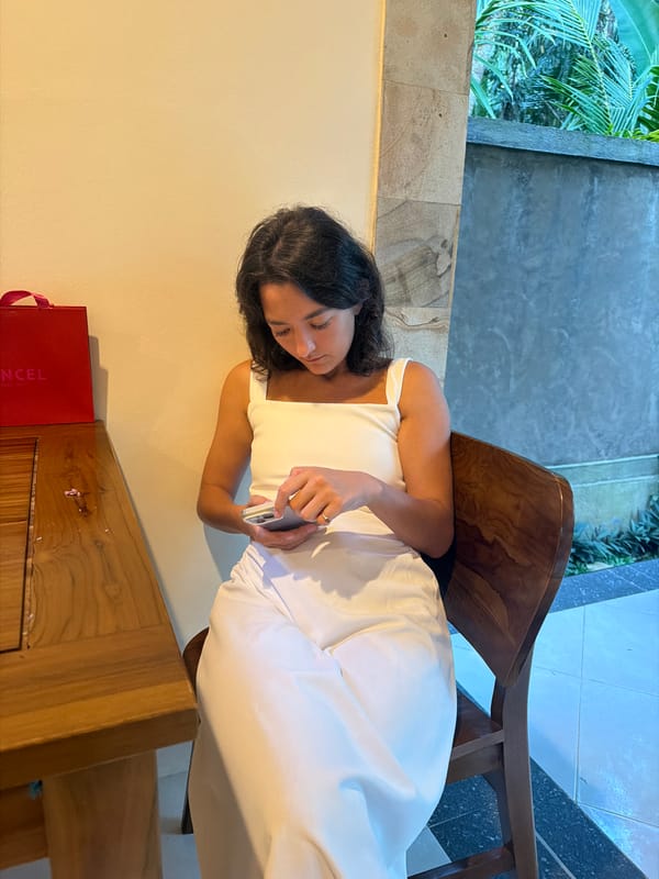 Woman with phone, poodle observed in Kedewatan home setting