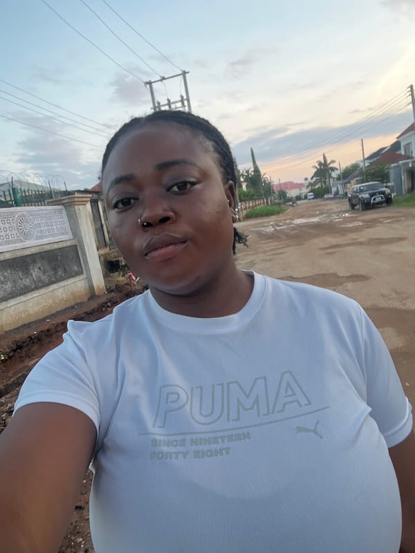 Morning street life across a residential Abuja neighborhood