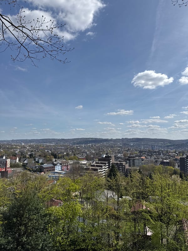 Panoramic view of Wuppertal cityscape captured amid rolling hills
