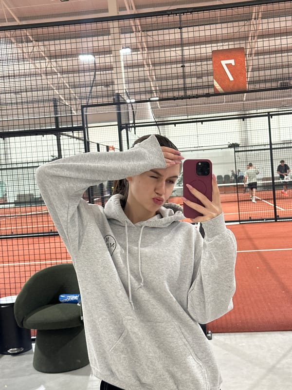 Woman documents morning visit to indoor padel tennis facility