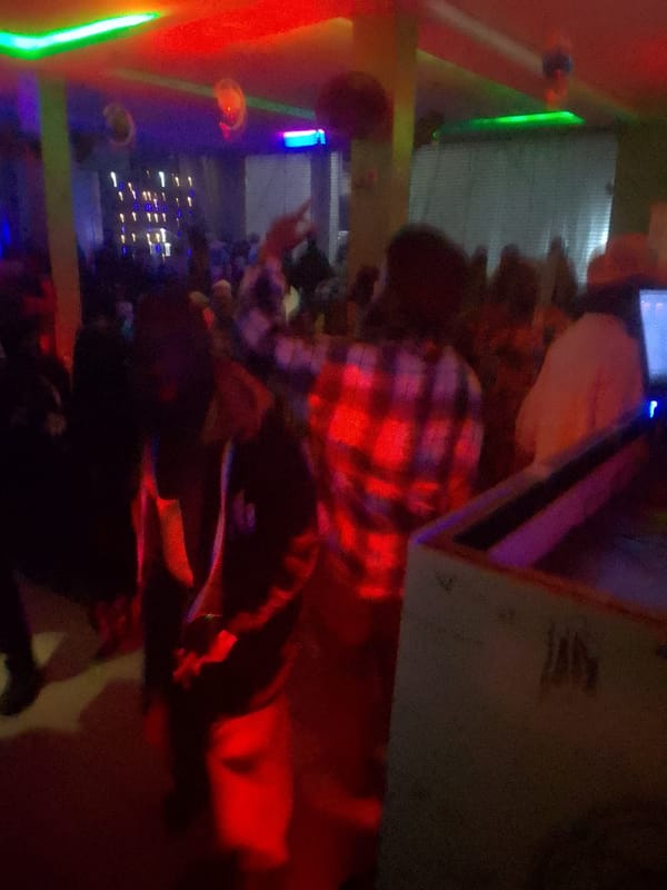 Nighttime bar gathering documented through dimly lit venue scenes