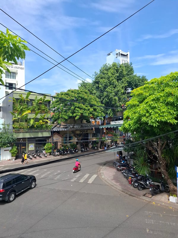 Nha Trang street corner with striking zigzag hotel backdrop