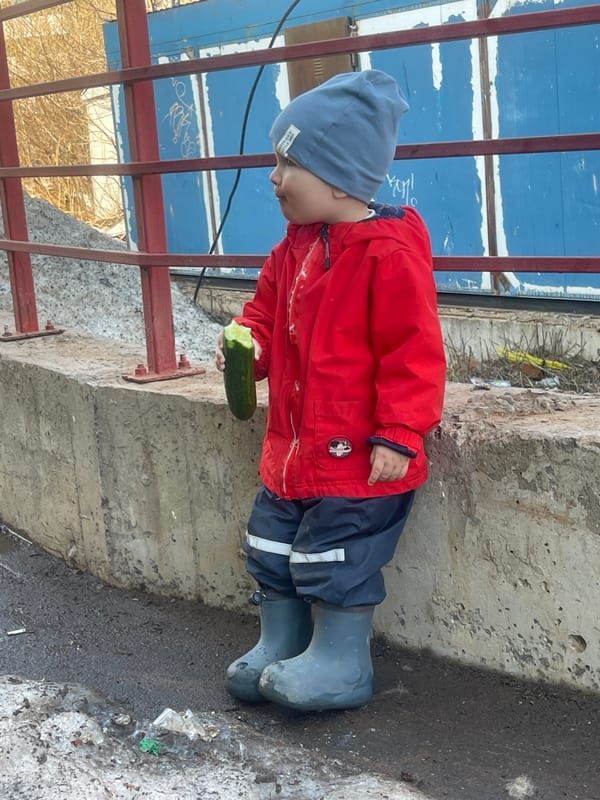 Child with cucumber spotted outdoors in Izhevsk, Russia