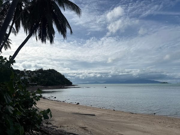 Lazy coastal morning on Ko Samui — beach, water, parked scooter