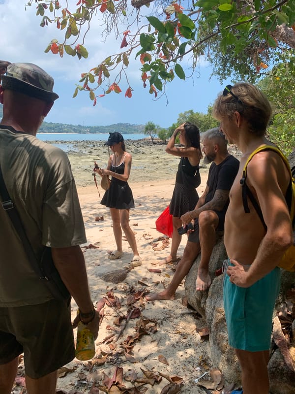 Five people gather on sunny Ko Samui beach