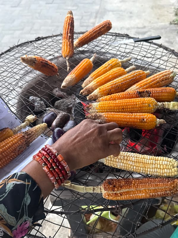 Corn grilling at a street food spot in Ado, Nigeria