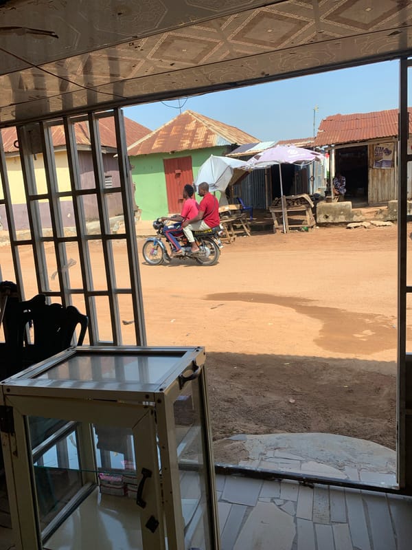 Inside and outside a small street-side shop or market stall