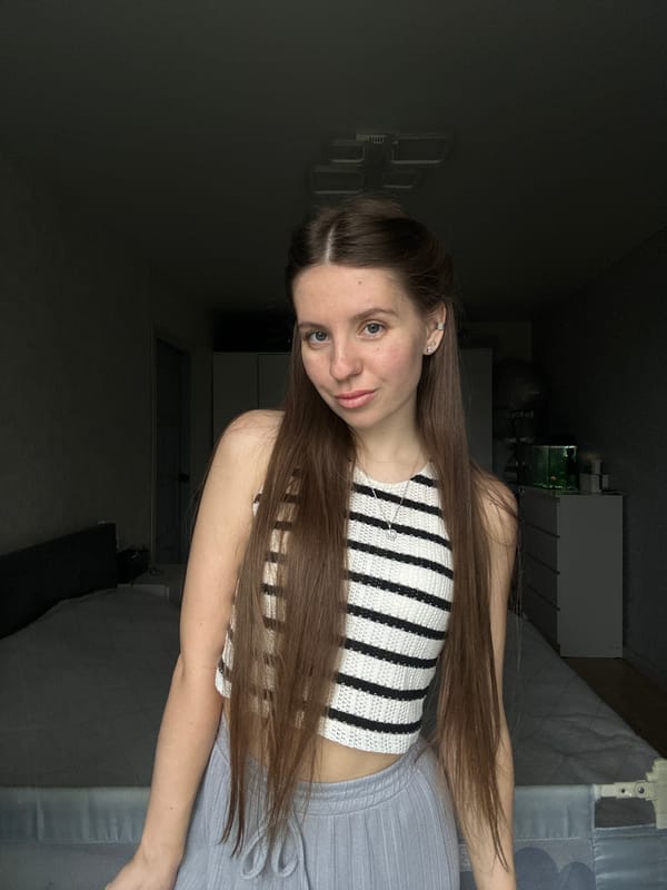 Woman photographed posing in bedroom in Klin, Russia