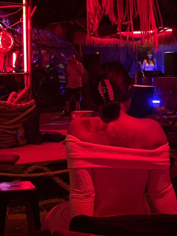 Red-lit bar night in Koh Phangan with DJs and neon décor