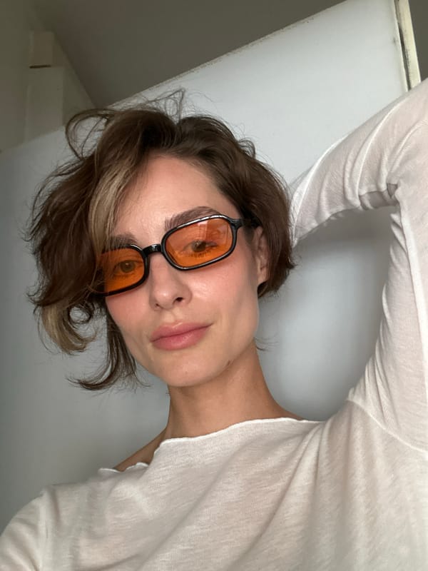 Woman takes selfie session in orange glasses, Kiel