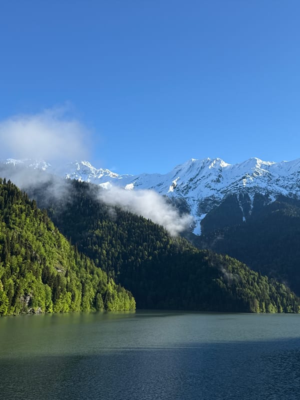 Snow-capped mountains observed in Abkhazia under clear skies